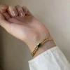 Guldarmband med 18K förgyllning med grön CZ>Celine Estelle