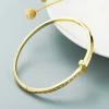 Guldarmring med 18K förgyllning med CZ>Celine Estelle Discount